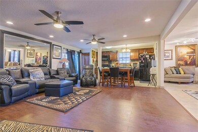 View of the den, kitchen and partial living room