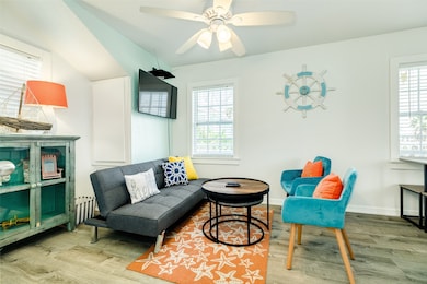 This cozy living room features a modern gray sofa,