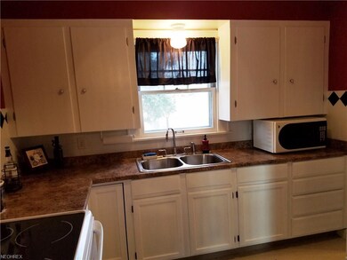 The updated, bright kitchen includes appliances an