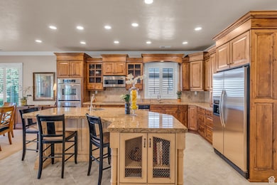 9' ceilings, custom cabinetry, granite countertops, 2 sinks, and radiant heating in floor
