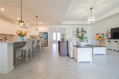 Kitchen with stainless steel refrigerator with ice
