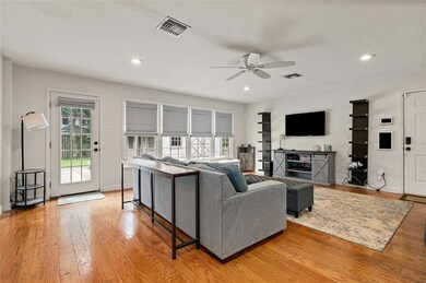 Living area with ceiling fan, light wood-type flooring, and recessed lighting