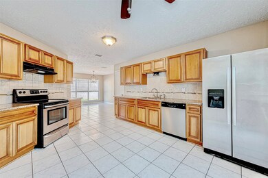 The kitchen features granite countertops