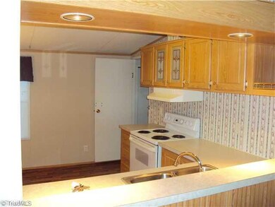 Kitchen. See thu bar/counter off of kiitchen looking into living room