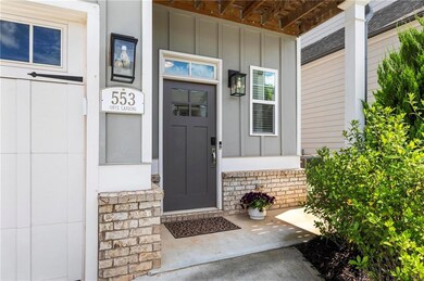 View of exterior entry with board and batten sidin
