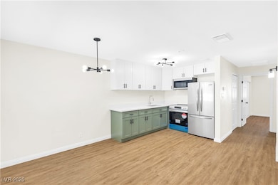 Kitchen featuring stainless steel electric range,