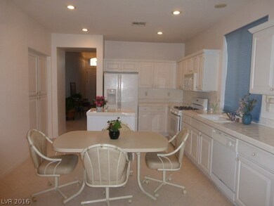 Kitchen features island, built-in microwave, pantr