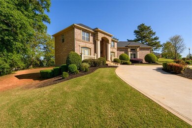 Mediterranean / spanish house featuring a front ya