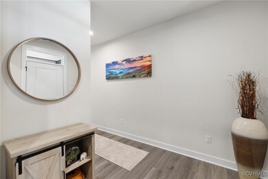 Hallway featuring dark wood-type flooring