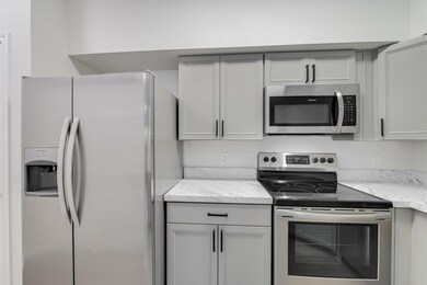 Kitchen with stainless steel appliances, light st