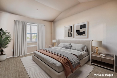 Bedroom with baseboards, vaulted ceiling, and car
