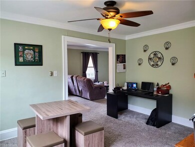 Dining room with built-ins and brand new carpet.