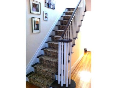 Bedroom. Carpeted stairway  to  bedrooms and bath.