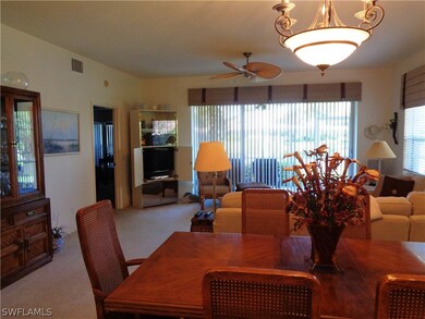 Dining room with carpet and ceiling fan with notab