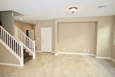 Foyer entrance with recessed lighting, stairs, bas