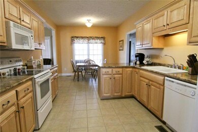 Bright kitchen ready for cooking with lots of cabinet space and lovely countertops