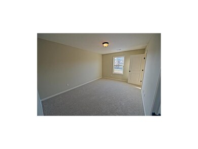 One of the upstairs bedrooms.