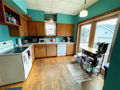 Kitchen area with hardwood floors.