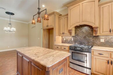Kitchen featuring pendant lighting, light hardwood