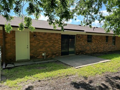 Back of property with a patio area and a lawn