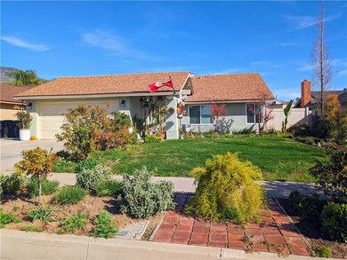 Front of the Home with Spectacular Gardens