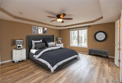 1rst floor master bedroom suite with laminate floo
