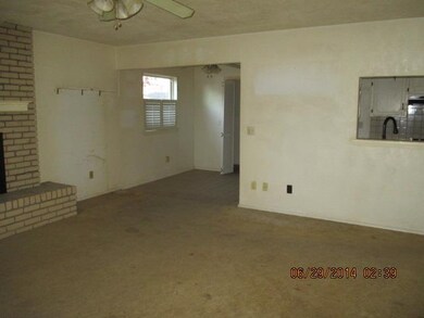 Open living with ceiling fan, pass through to kitc