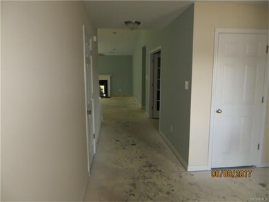 Foyer with hallway to living area.