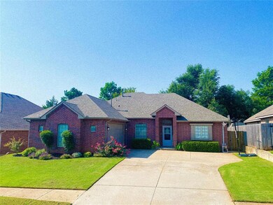 Ranch-style home featuring a front lawn