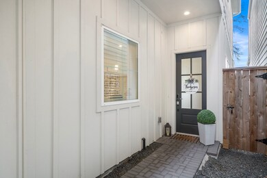 Elegant front porch with a privacy fence featuring