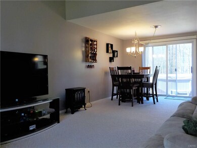 Open floor plan with cathedral ceilings and slidin