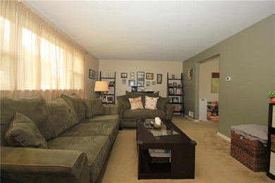 The living room is showered with natural light thr