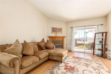 Spacious living room with gas fireplace and slidin