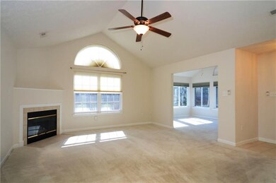 FORMAL LIVING ROOM HAS EASY ACCESS TO THE SUNROOM/