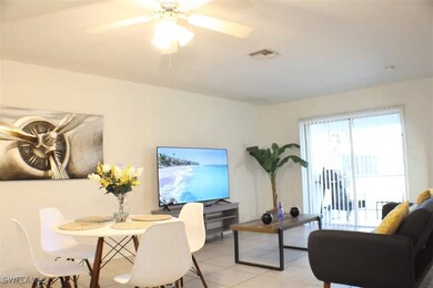 Dining area with light tile patterned flooring and