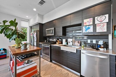 Kitchen featuring appliances with stainless steel