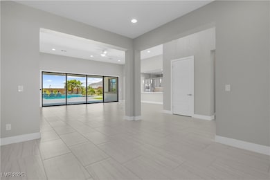 Spare room with a ceiling fan, recessed lighting,