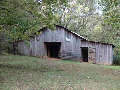 30x30 5 stall barn with sheds on each side
