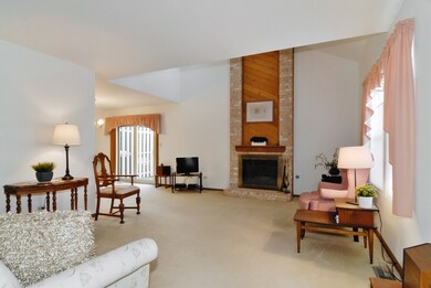 Vaulted, sunny, neutral and a gas fireplace that a