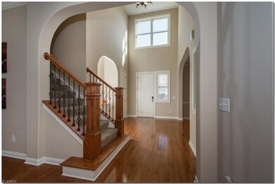 Beautiful light filled entry with hardwood