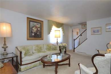 LIVING ROOM; Main floor staircase to 2nd floor is 