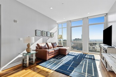 Living room with hardwood / wood-style flooring an