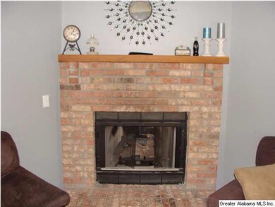 BRICK FIREPLACE WITH GAS LOGS IN THE GREAT ROOM...