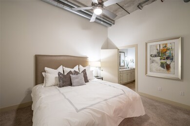The generously sized bedroom serves as a tranquil