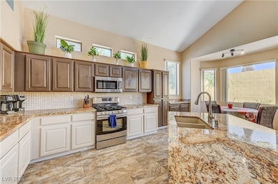 Kitchen with appliances with stainless steel finis