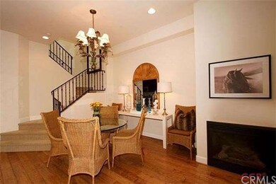 Dining area enjoys the warmth from the fireplace. 