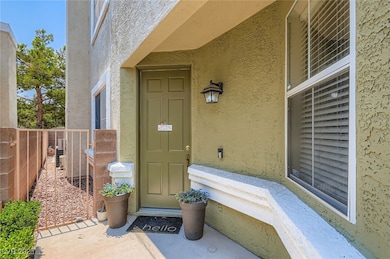 Doorway to property with stucco siding