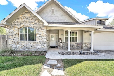 View of front of property featuring concrete driv