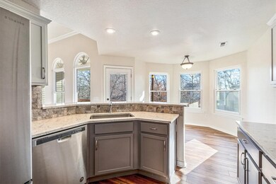 Kitchen has ample amount of cabinets and counter space.  Updated counters, back splash and cabinets from original.