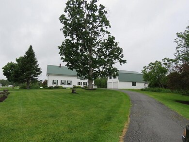 Front Yard. A large garage with...